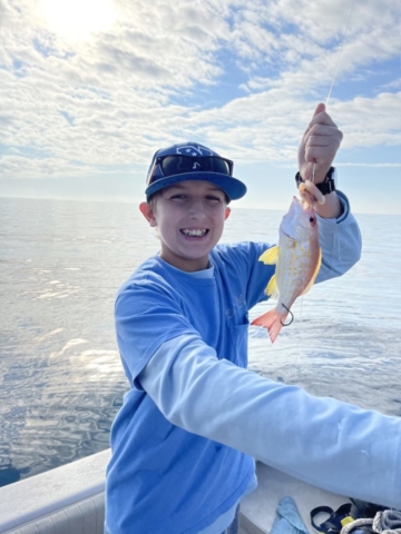 Kids fishing for snapper offshore fishing charter Venice, FL